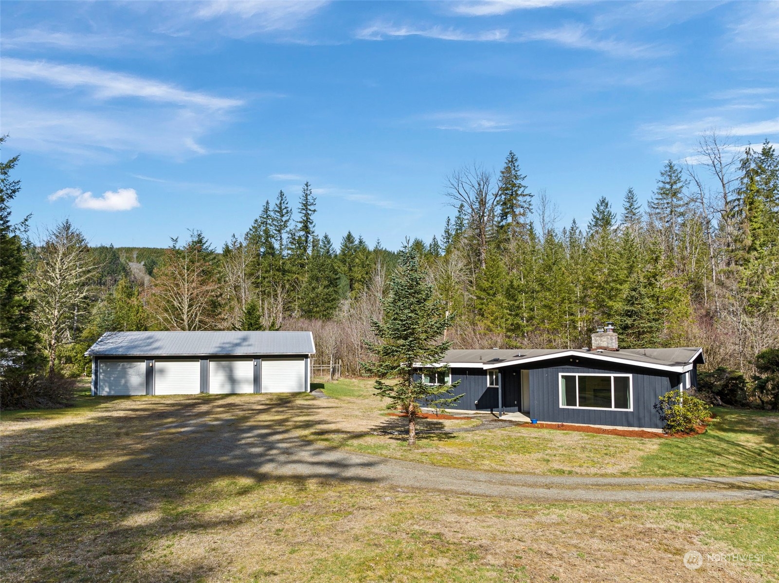 44223 Southeast Ernies Grove Road Snoqualmie, WA 98065 - Photo 16 of 21 a view of a house with a yard