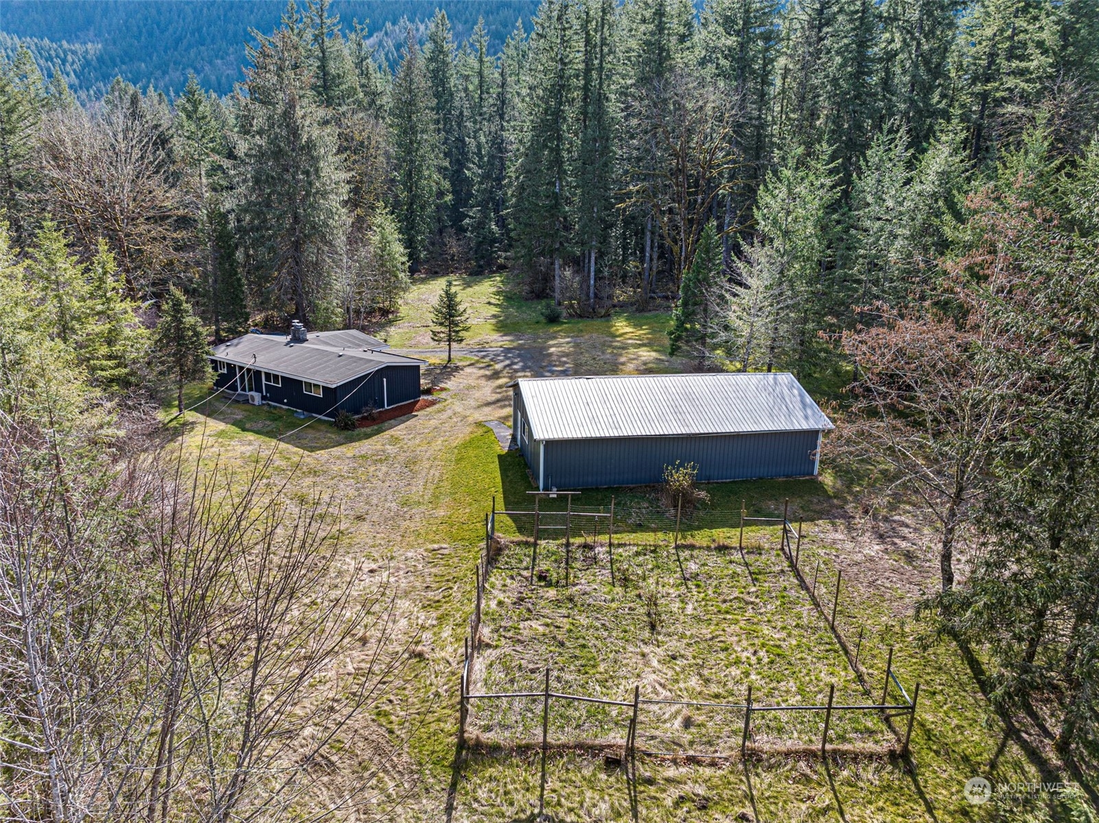 44223 Southeast Ernies Grove Road Snoqualmie, WA 98065 - Photo 2 of 21 a view of a yard with furniture