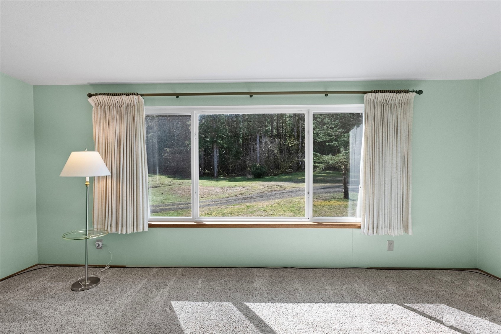 44223 Southeast Ernies Grove Road Snoqualmie, WA 98065 - Photo 5 of 21 a living room with a large window
