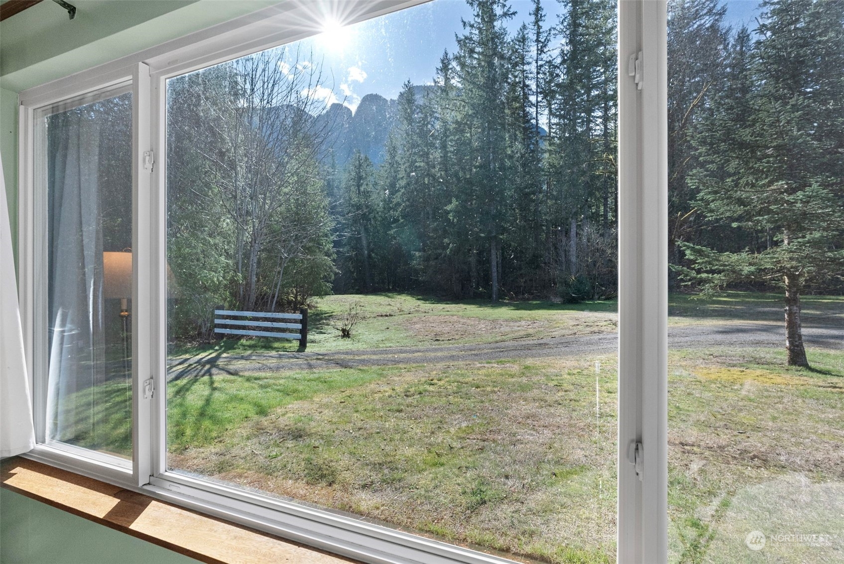 44223 Southeast Ernies Grove Road Snoqualmie, WA 98065 - Photo 6 of 21 a view of a glass door and a yard