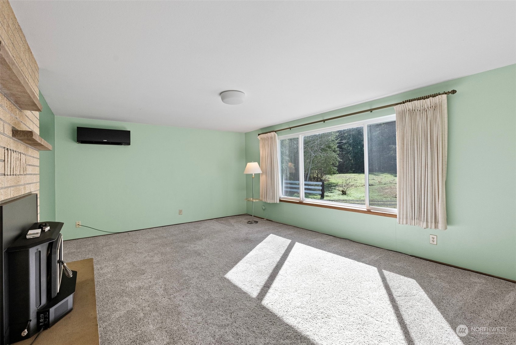 44223 Southeast Ernies Grove Road Snoqualmie, WA 98065 - Photo 7 of 21 a view of an empty room with a window