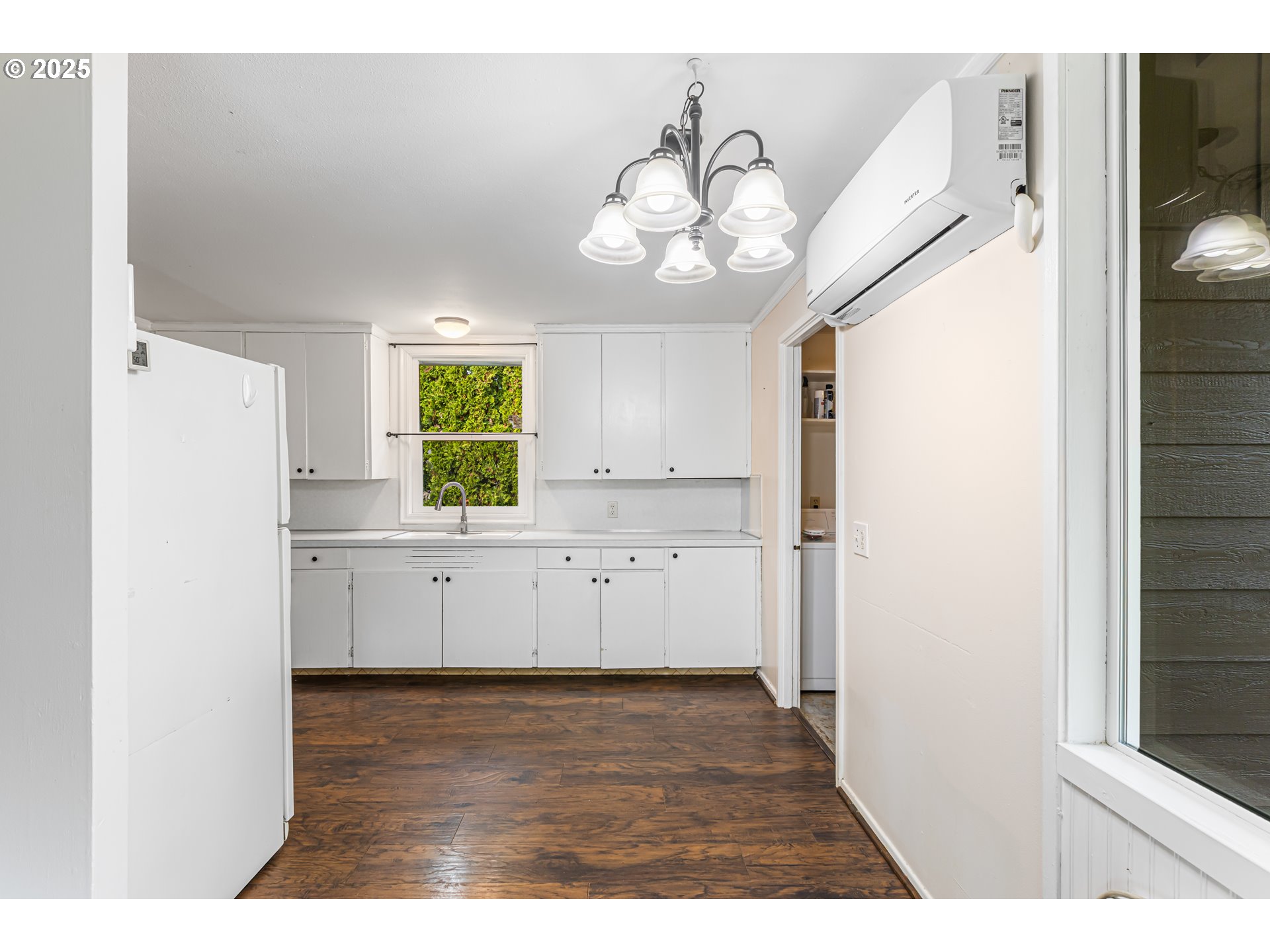532 2nd Street Elkton, OR 97436 - Photo 11 of 32 a kitchen with a refrigerator a stove cabinets and a window