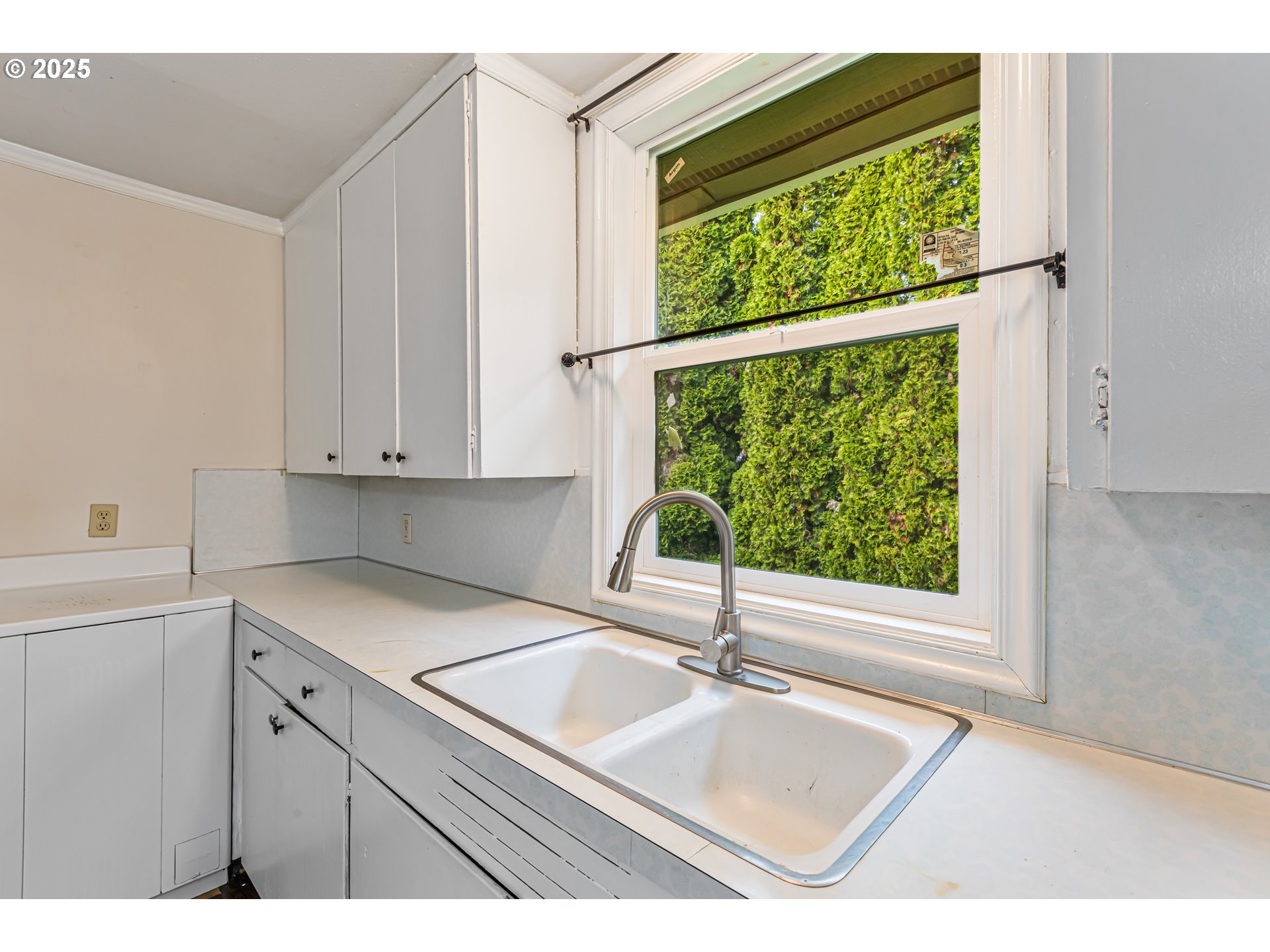 532 2nd Street Elkton, OR 97436 - Photo 16 of 32 a kitchen with a sink and large window