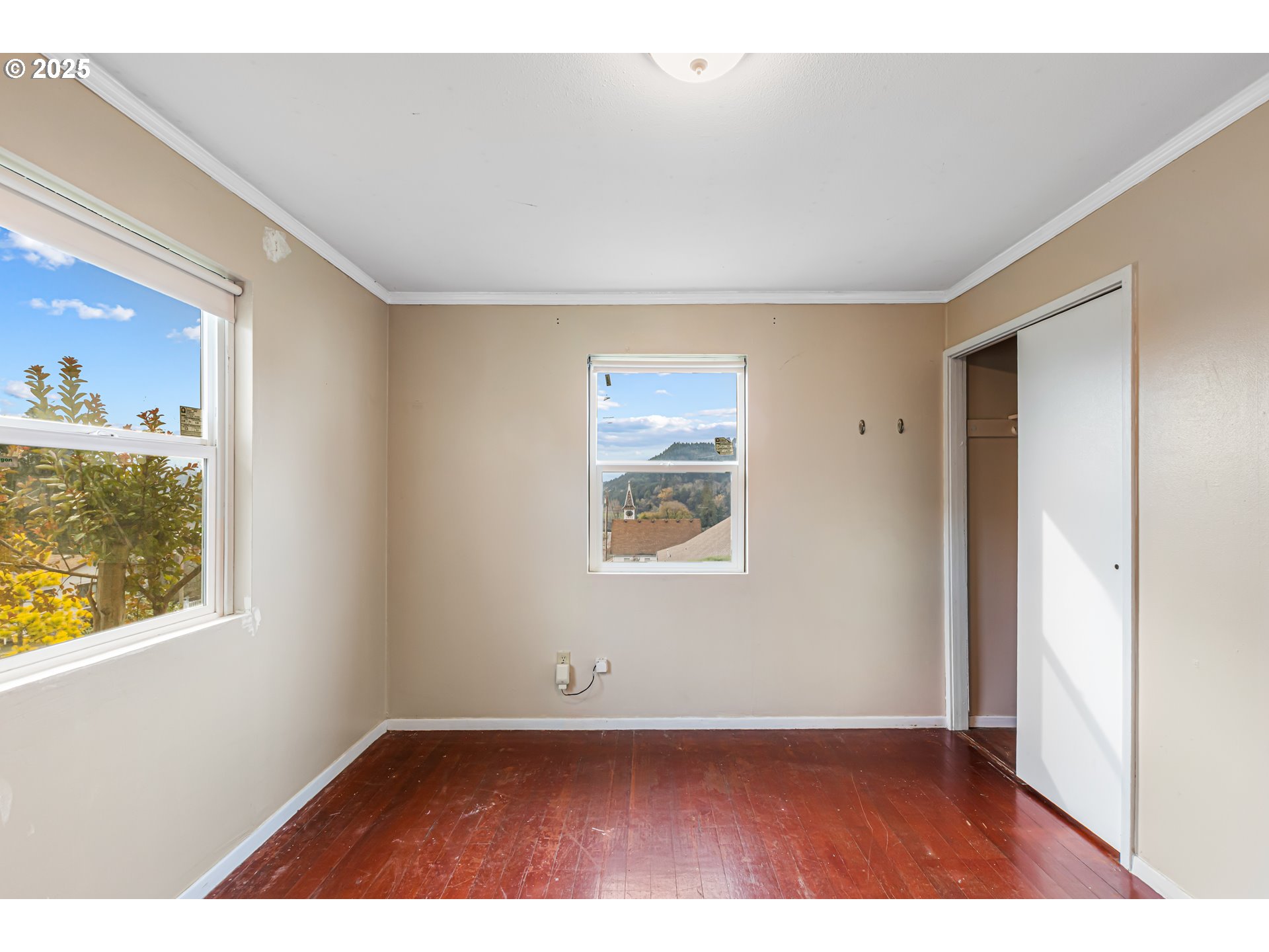 532 2nd Street Elkton, OR 97436 - Photo 18 of 32 an empty room with wooden floor and windows