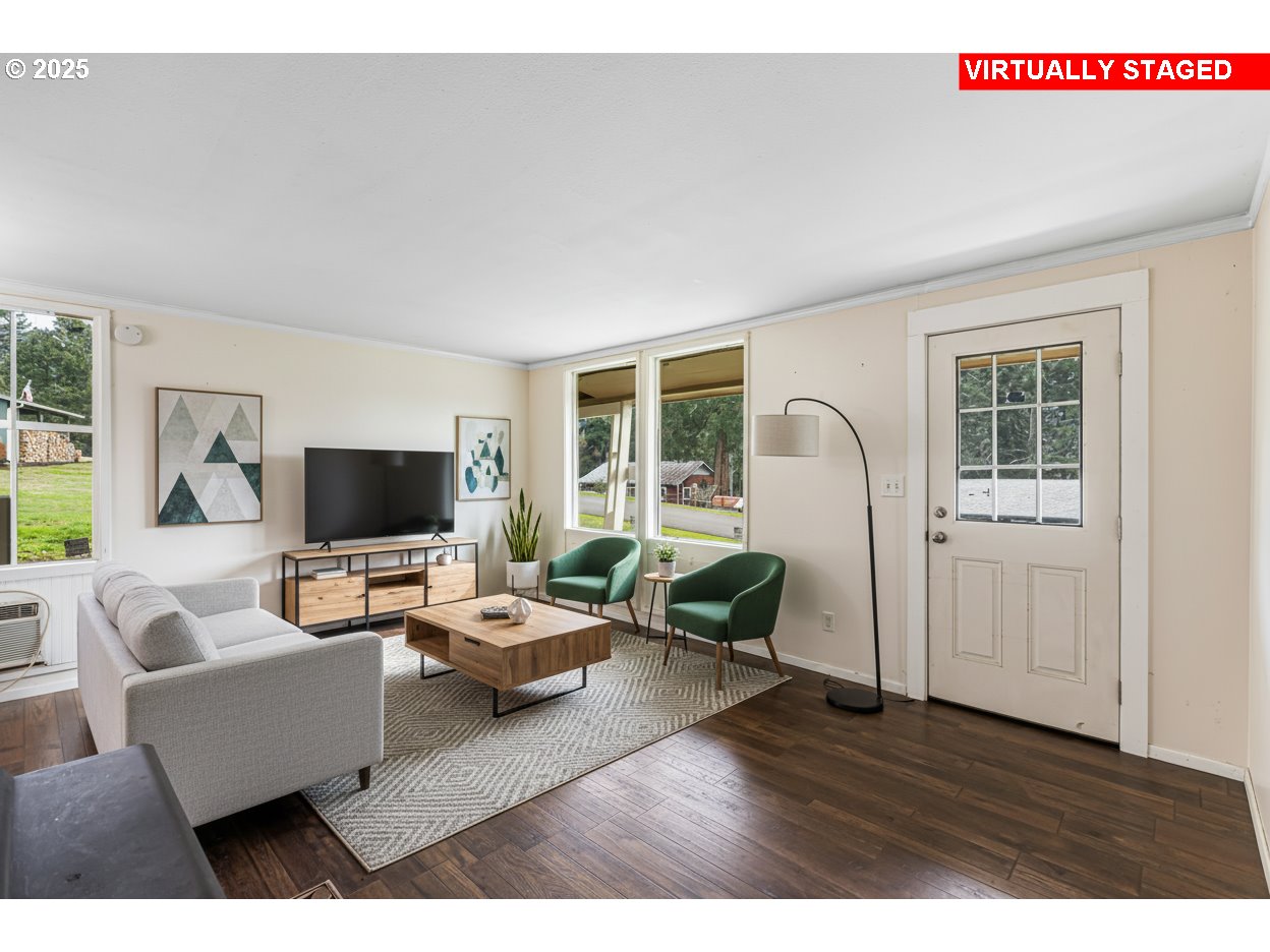 532 2nd Street Elkton, OR 97436 - Photo 7 of 32 a living room with furniture and a flat screen tv