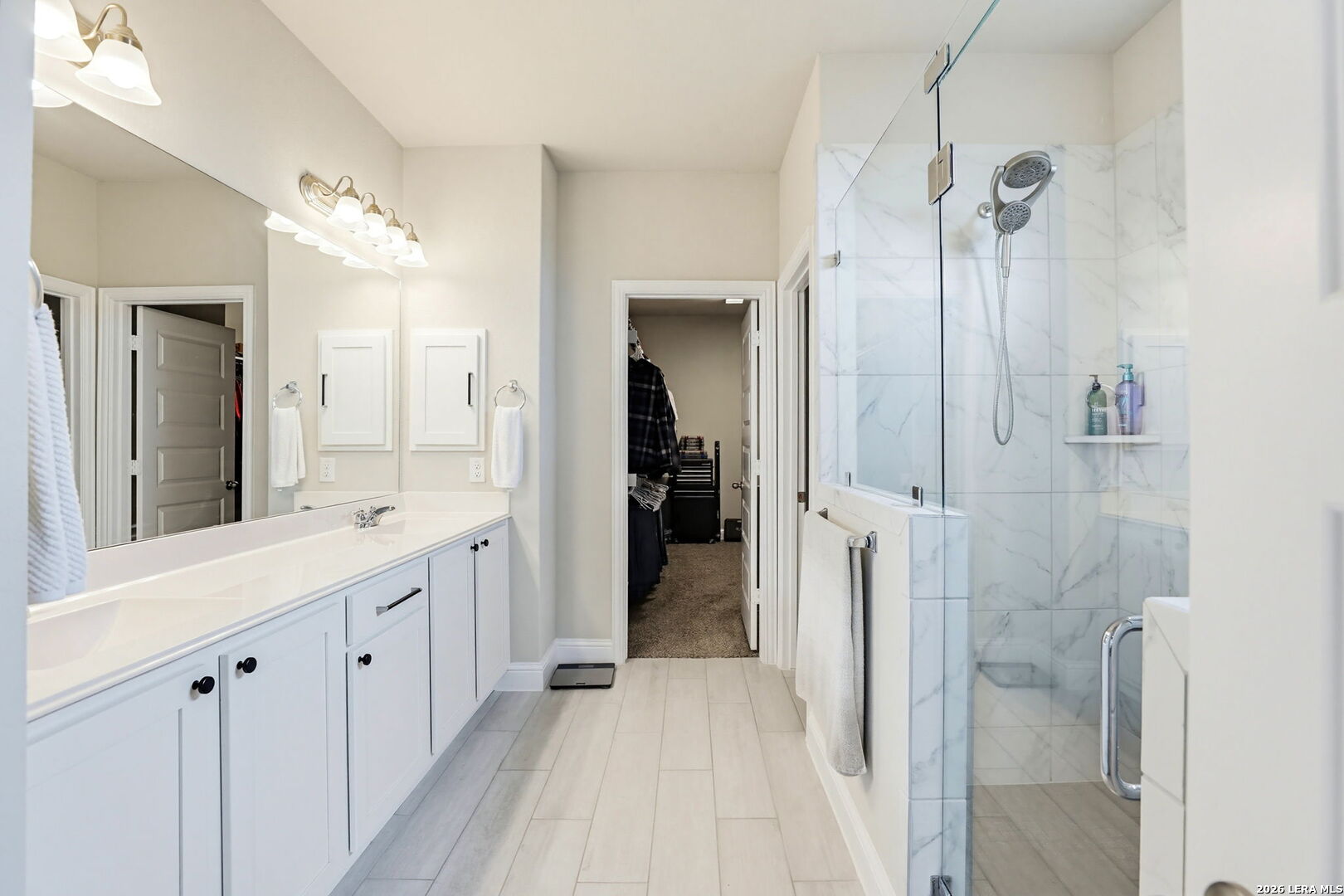 4174 Garden Path Marion, TX 78124 - Photo 13 of 21 a bathroom with a double vanity sink and a mirror