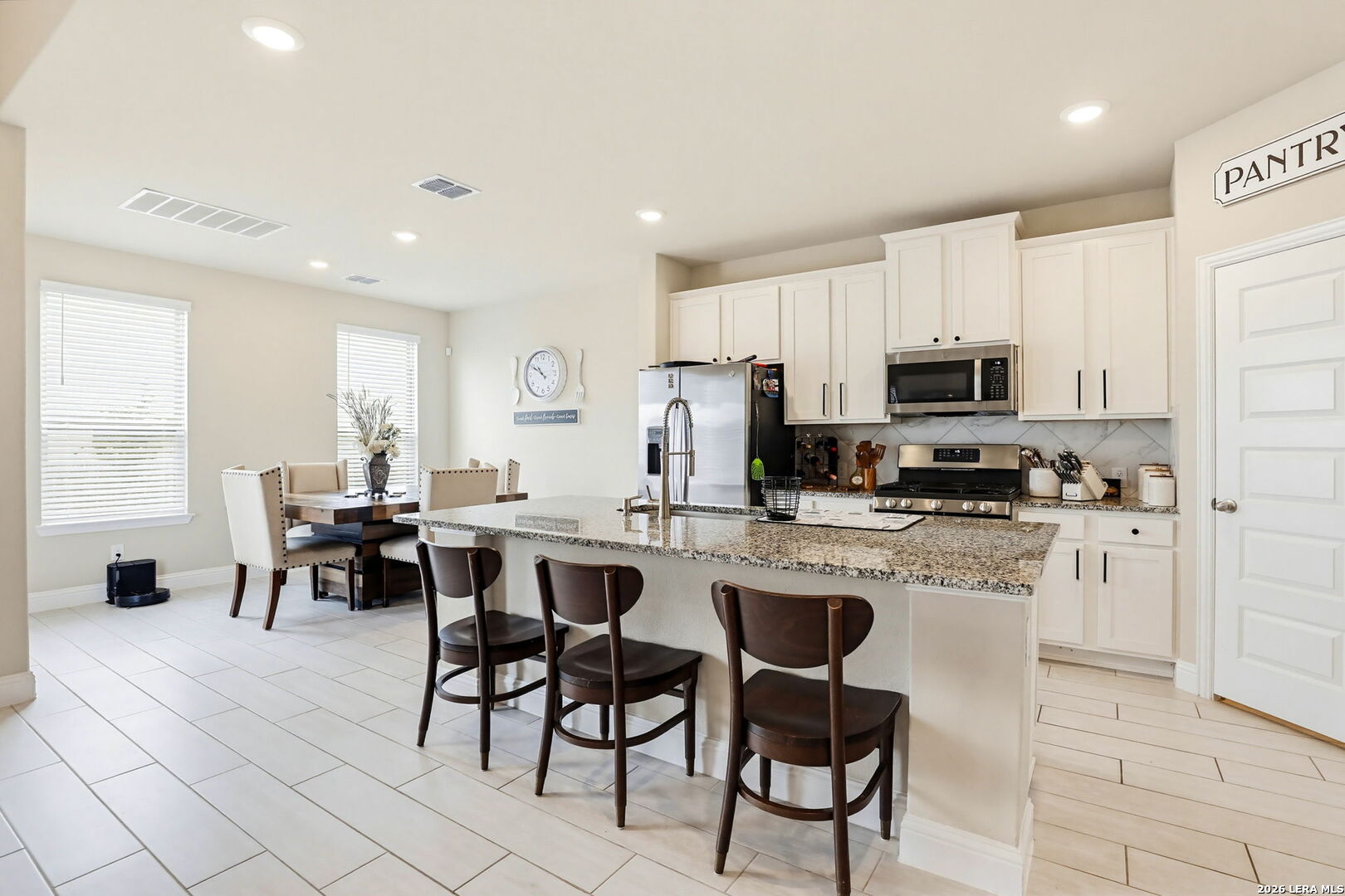 4174 Garden Path Marion, TX 78124 - Photo 3 of 21 a kitchen with appliances a sink a counter top space and appliances
