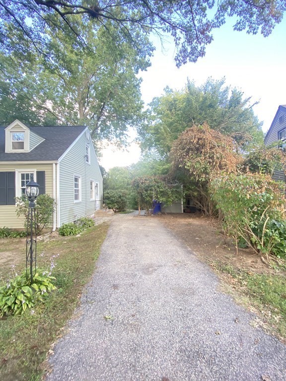 61 Arden Street Springfield, MA 01118 - Photo 3 of 19 a view of a road with a house in the background