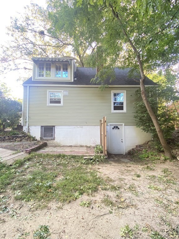 61 Arden Street Springfield, MA 01118 - Photo 5 of 19 a house that has a tree in front of it