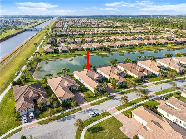 a view of a house with a yard patio and swimming pool
