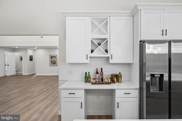 a kitchen with stainless steel appliances a sink stove and cabinets
