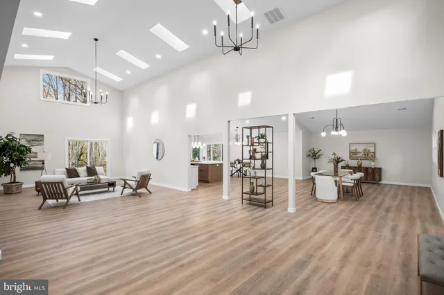 a room with lots of table and chairs