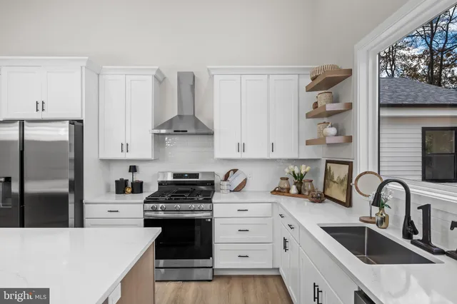 a kitchen that has a table and chairs in it