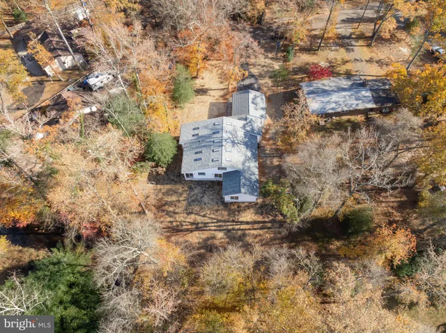an aerial view of residential house with outdoor space