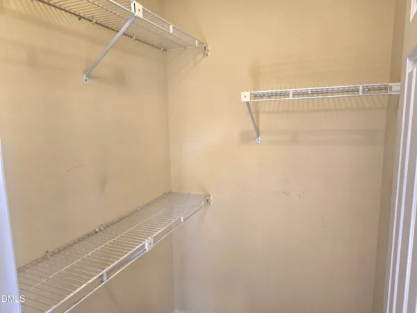 a view of a room with racks on the wall