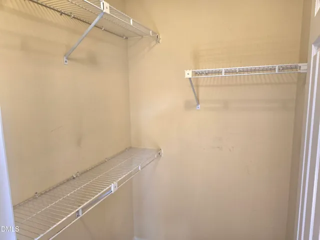 a view of a room with racks on the wall