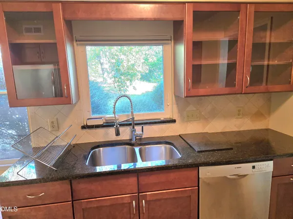 a kitchen with a sink and a window