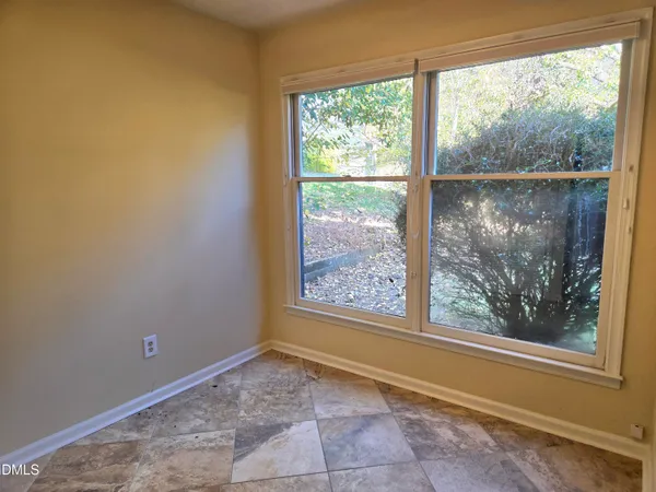 a view of a room with a large window