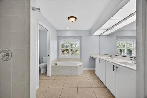 a bathroom with a bathtub and a sink