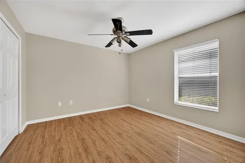 a view of a room that has a window and a sink