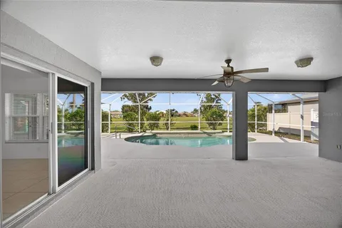 a view of a hallway with a livingroom view
