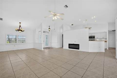 a kitchen with white cabinets appliances and a sink