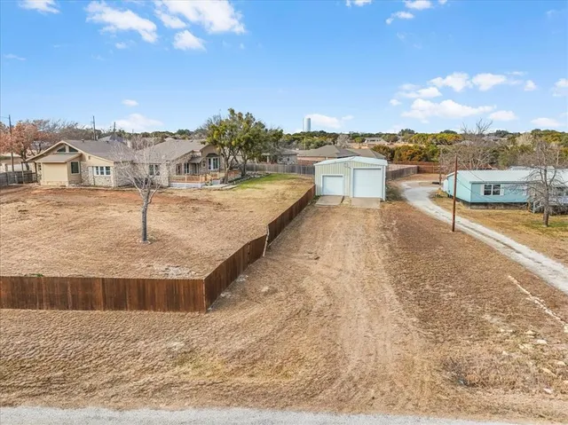 a view of a swimming pool and a yard