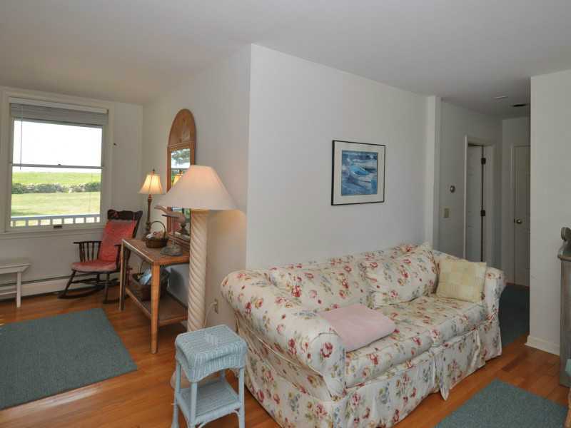Den/Family/Great Room. L-shaped room with two doors to the porch