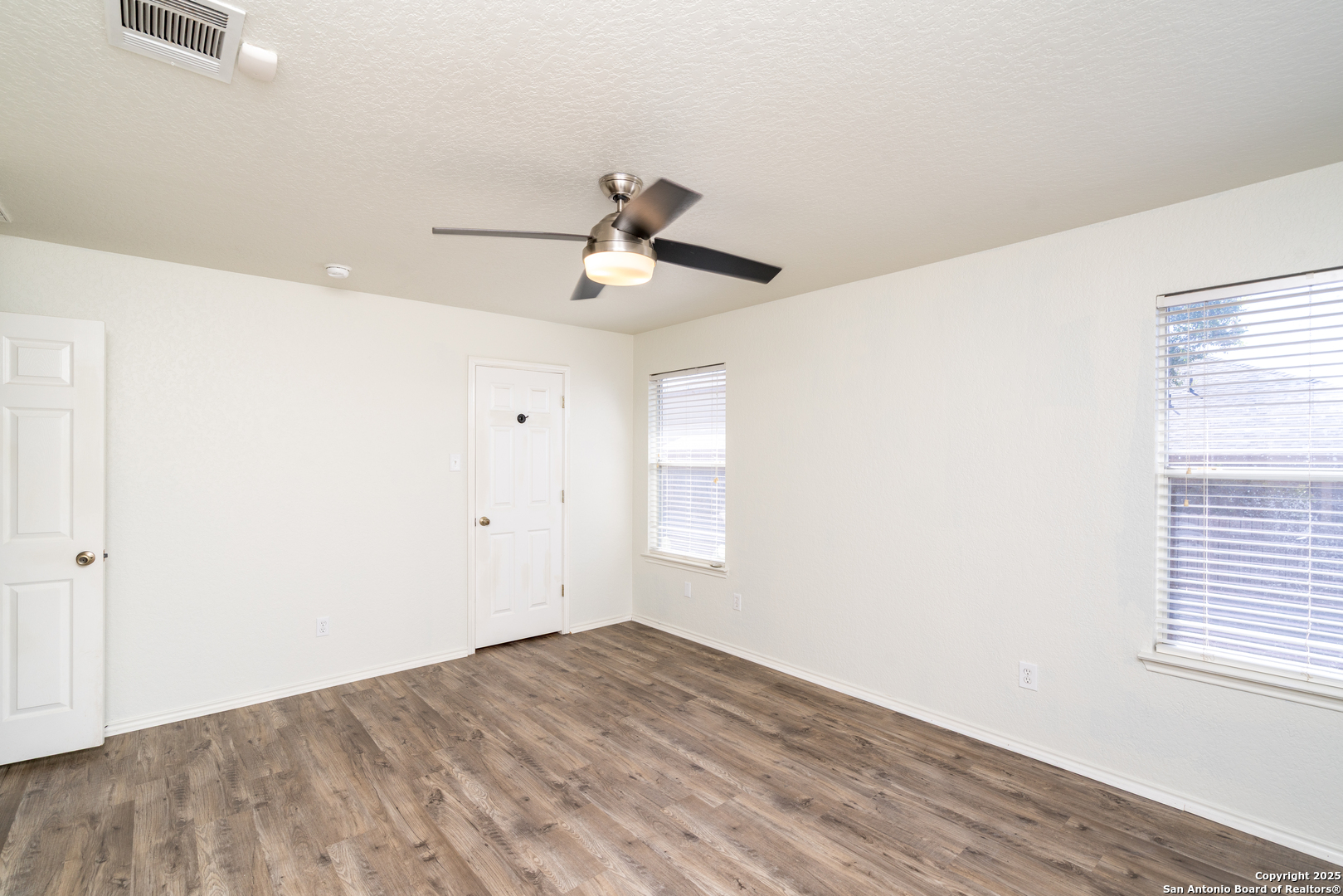 720 Fountain Gate Schertz, TX 78108 - Photo 19 of 34 a view of empty room with wooden floor and fan