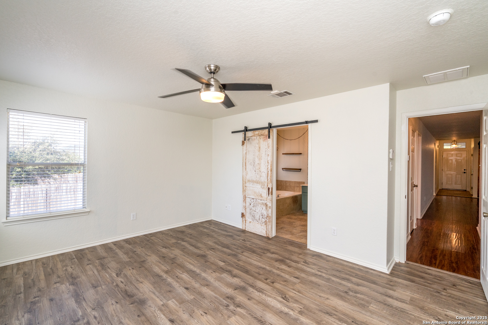 720 Fountain Gate Schertz, TX 78108 - Photo 21 of 34 a view of empty room with wooden floor and fan