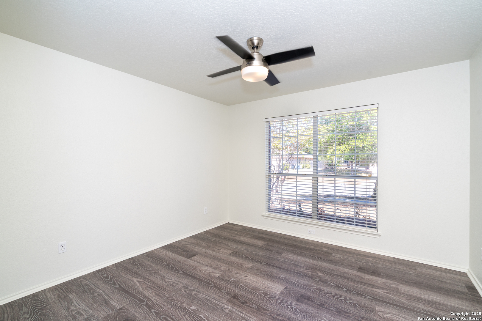 720 Fountain Gate Schertz, TX 78108 - Photo 28 of 34 a view of a room with wooden floor and a window
