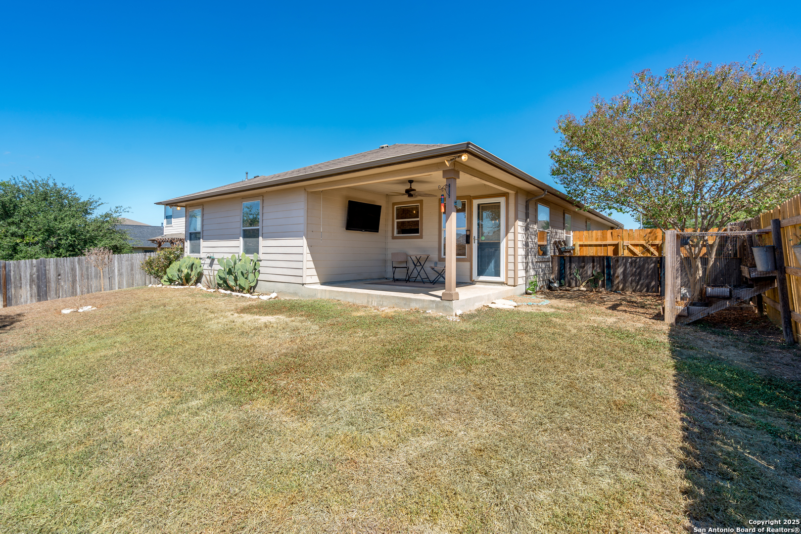 720 Fountain Gate Schertz, TX 78108 - Photo 31 of 34 a front view of house with yard and trees in the background