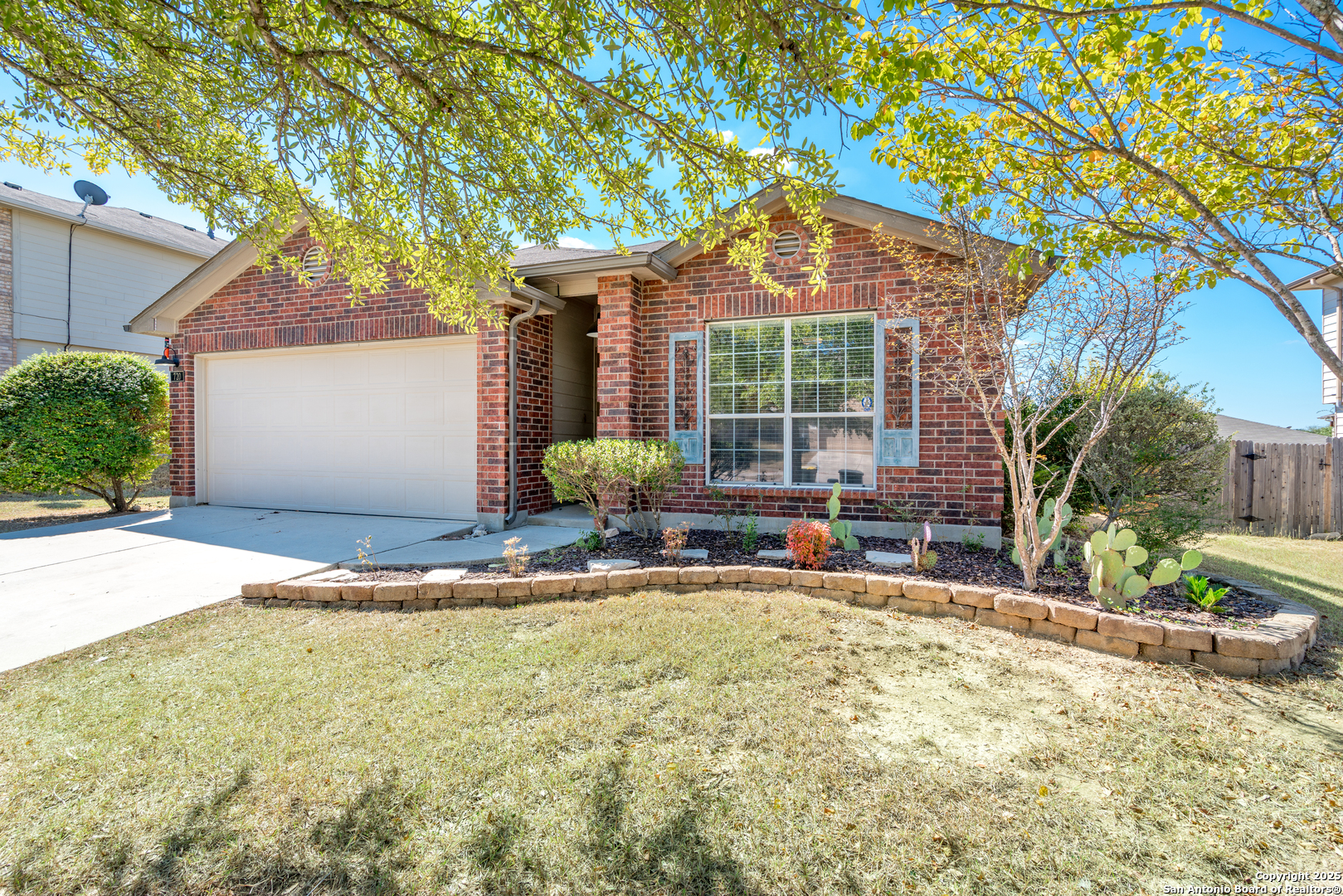 720 Fountain Gate Schertz, TX 78108 - Photo 5 of 34 a front view of a house with a garden and porch