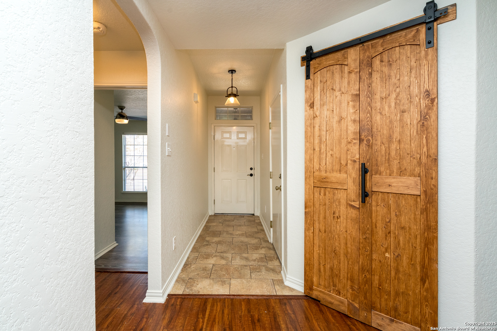 720 Fountain Gate Schertz, TX 78108 - Photo 7 of 34 a view of a hallway with wooden floor and closet