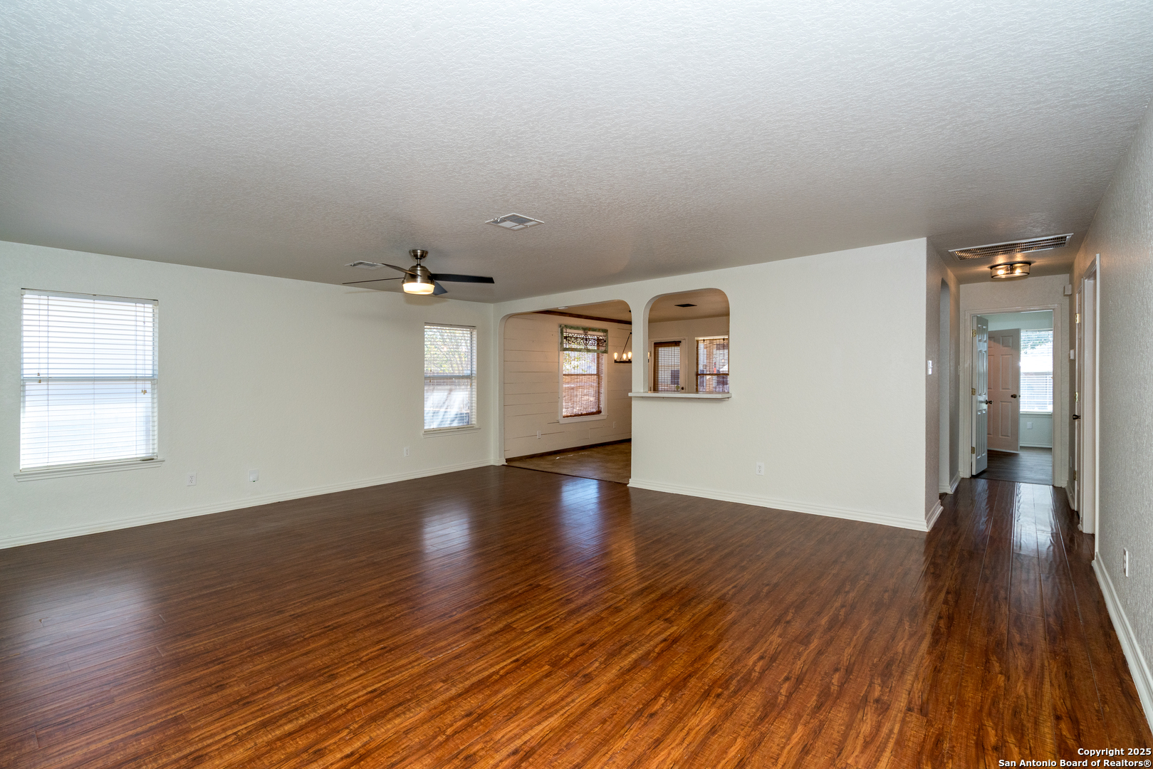 720 Fountain Gate Schertz, TX 78108 - Photo 8 of 34 wooden floor in an empty room with a window