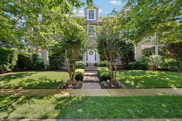 a view of entryway livingroom and hall with wooden floor