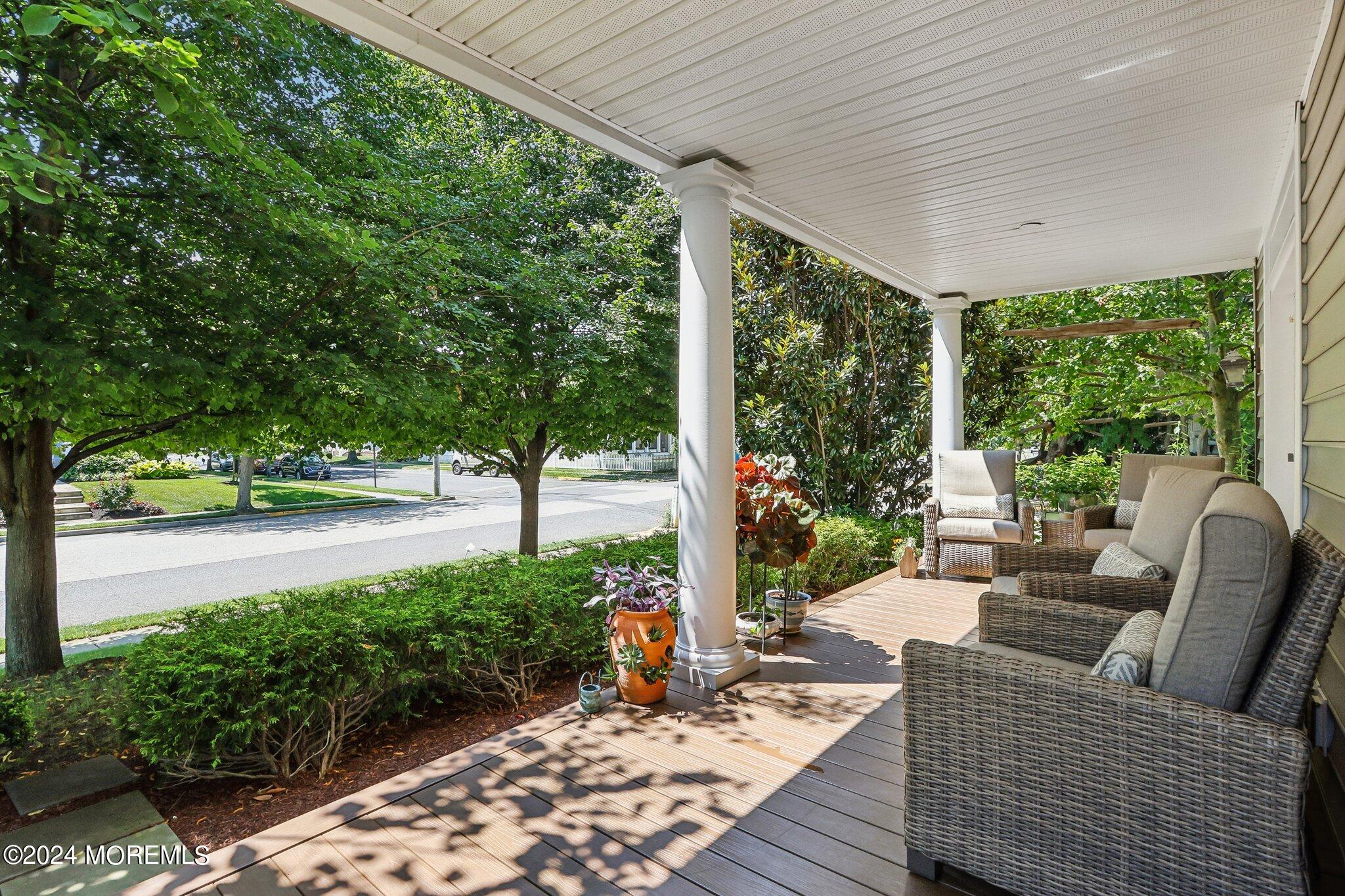 317 Worthington Avenue Spring Lake, NJ 07762 - Photo 13 of 85 a view of a patio with couches table and chairs and potted plants