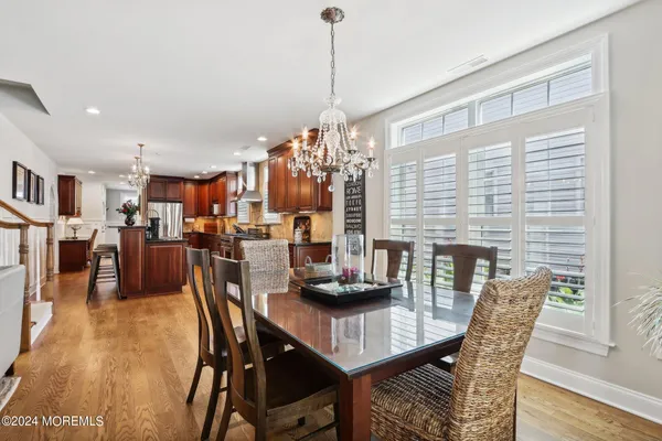 a living room with furniture and a kitchen