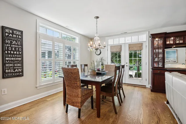 a bathroom with a toilet a sink and a mirror