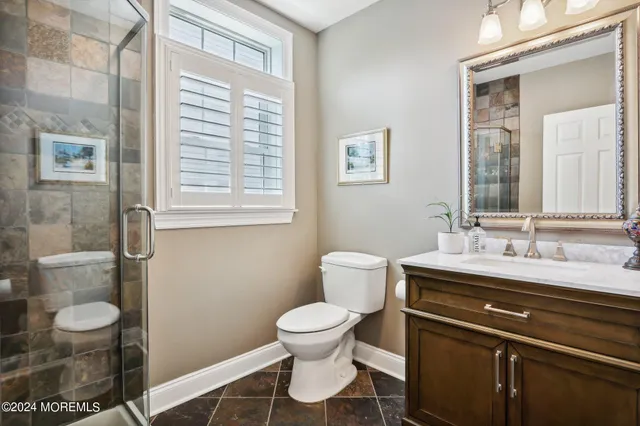 a bathroom with a double vanity sink mirror and double