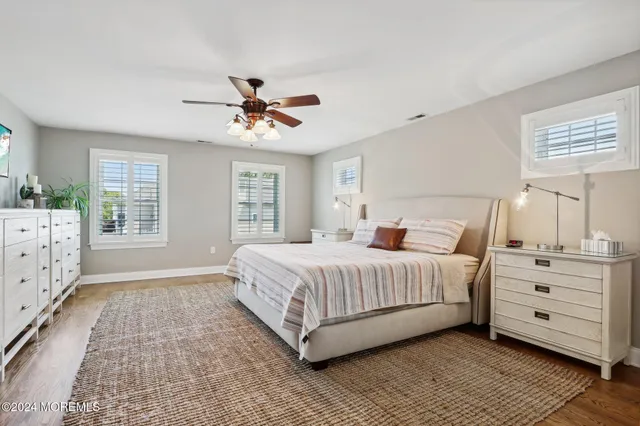 a kitchen with a sink and wooden floor