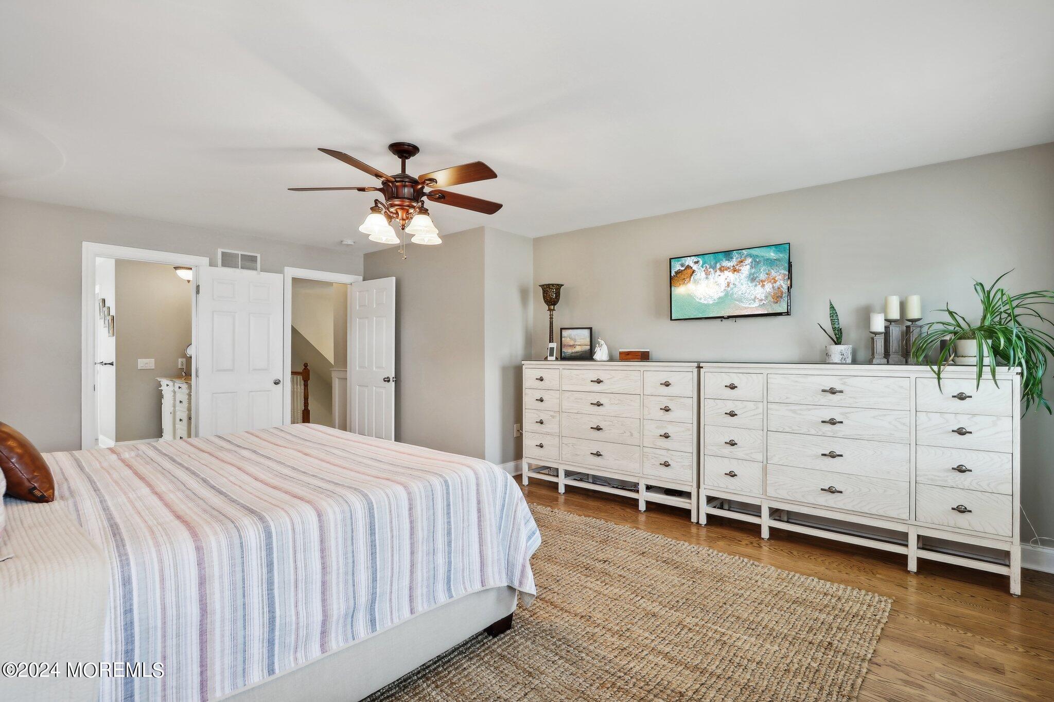 317 Worthington Avenue Spring Lake, NJ 07762 - Photo 38 of 85 a spacious bedroom with a bed and a dresser