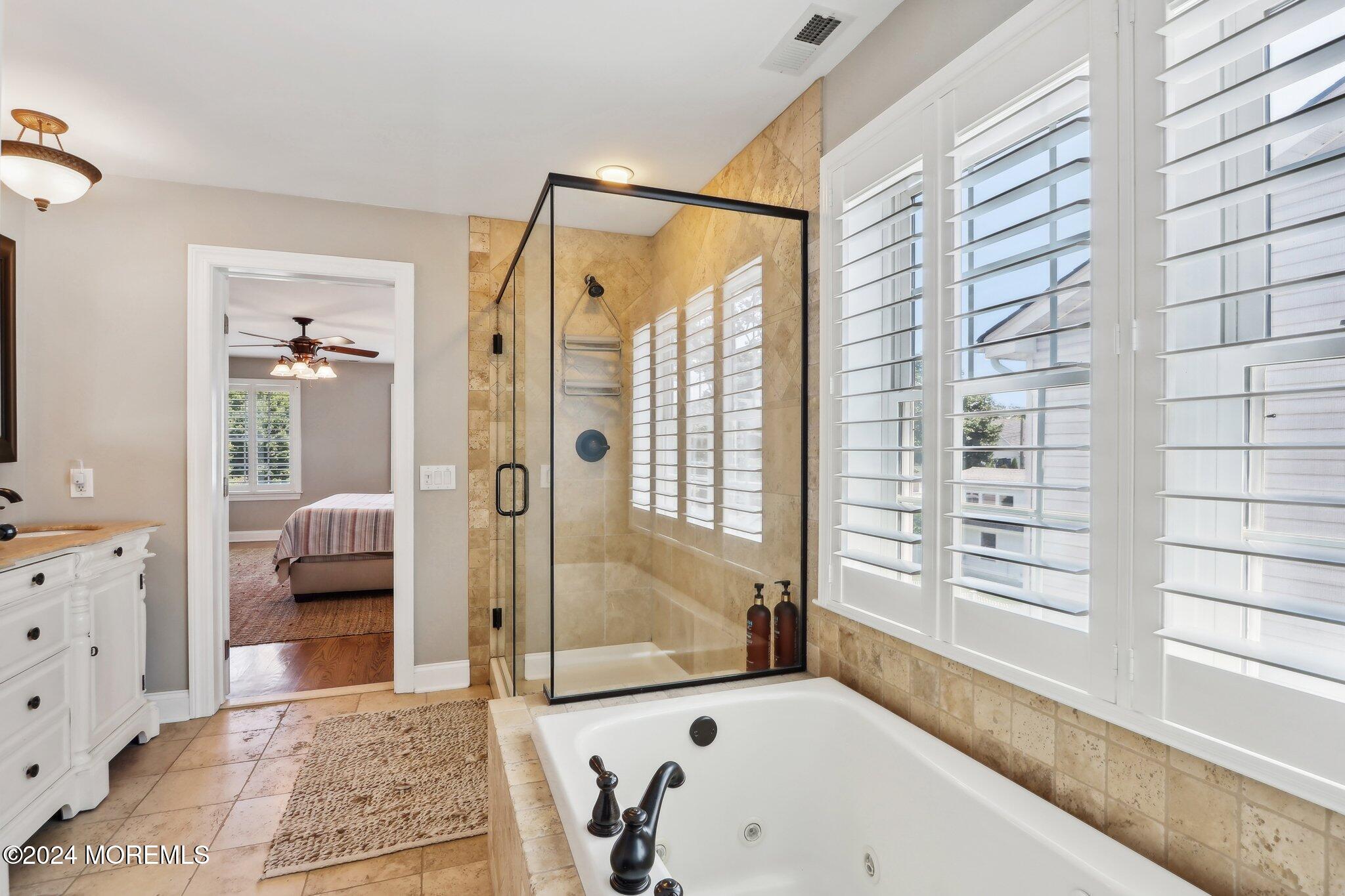 317 Worthington Avenue Spring Lake, NJ 07762 - Photo 41 of 85 a bathroom with a bathtub and a shower