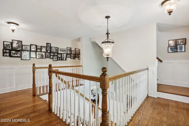 a living room with furniture ceiling fan and a rug