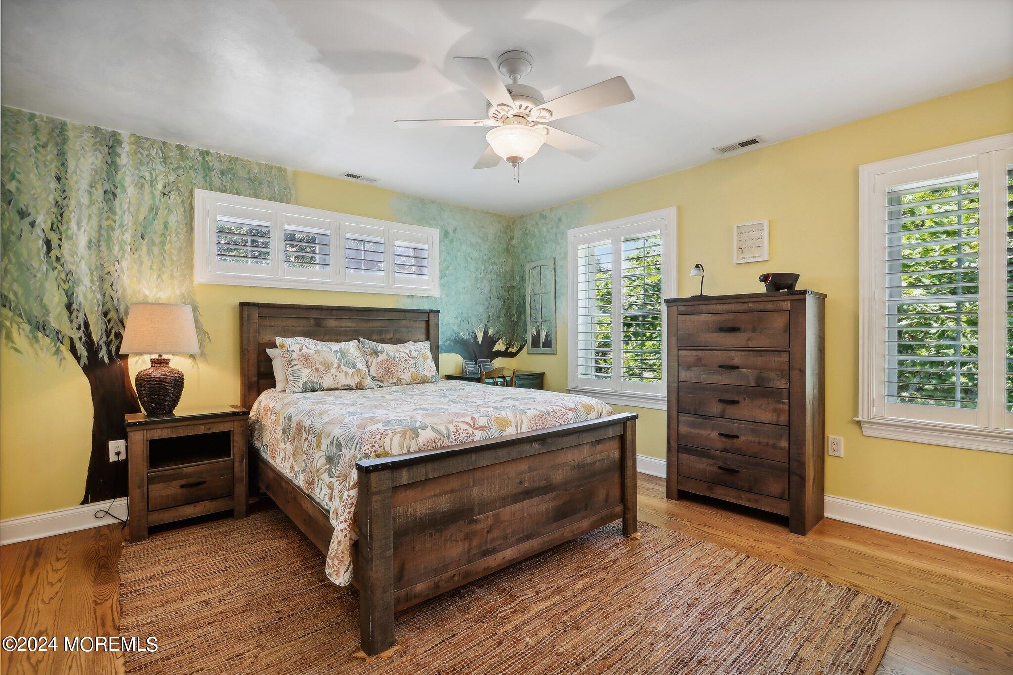 317 Worthington Avenue Spring Lake, NJ 07762 - Photo 44 of 85 a bedroom with a bed and a dresser