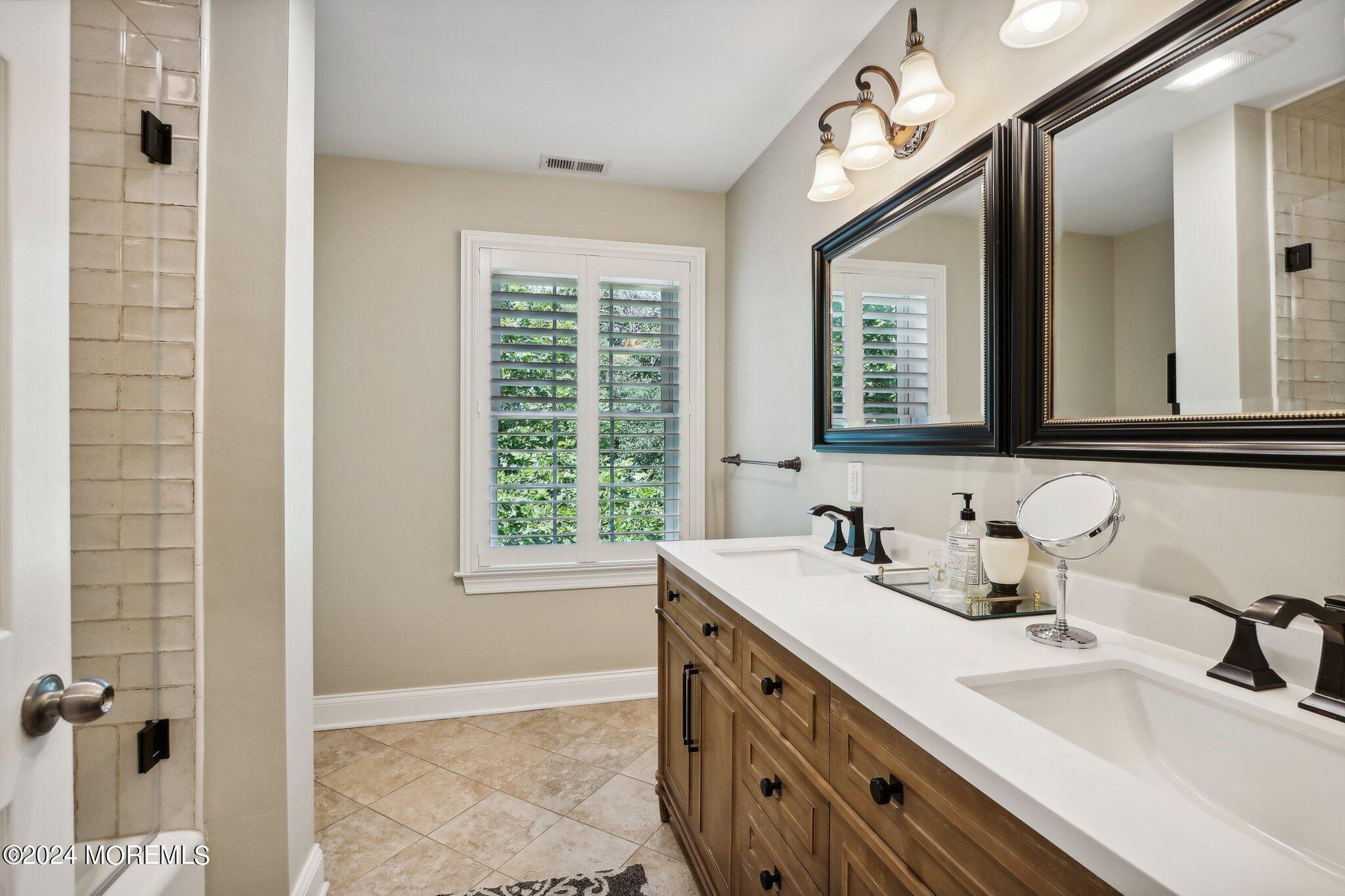 317 Worthington Avenue Spring Lake, NJ 07762 - Photo 45 of 85 a bathroom with a double vanity sink mirror and double