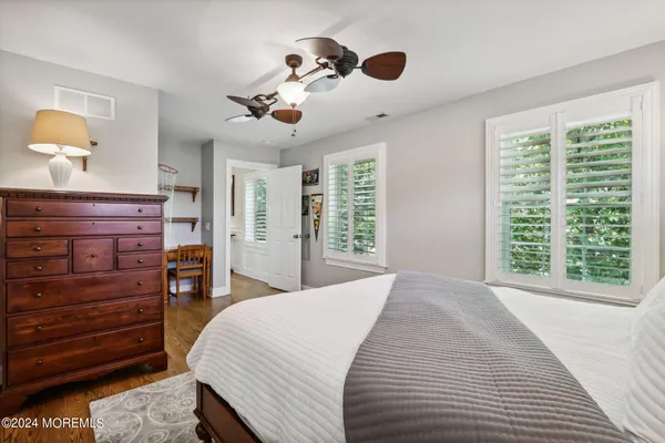 a view of backyard with seating space and trees