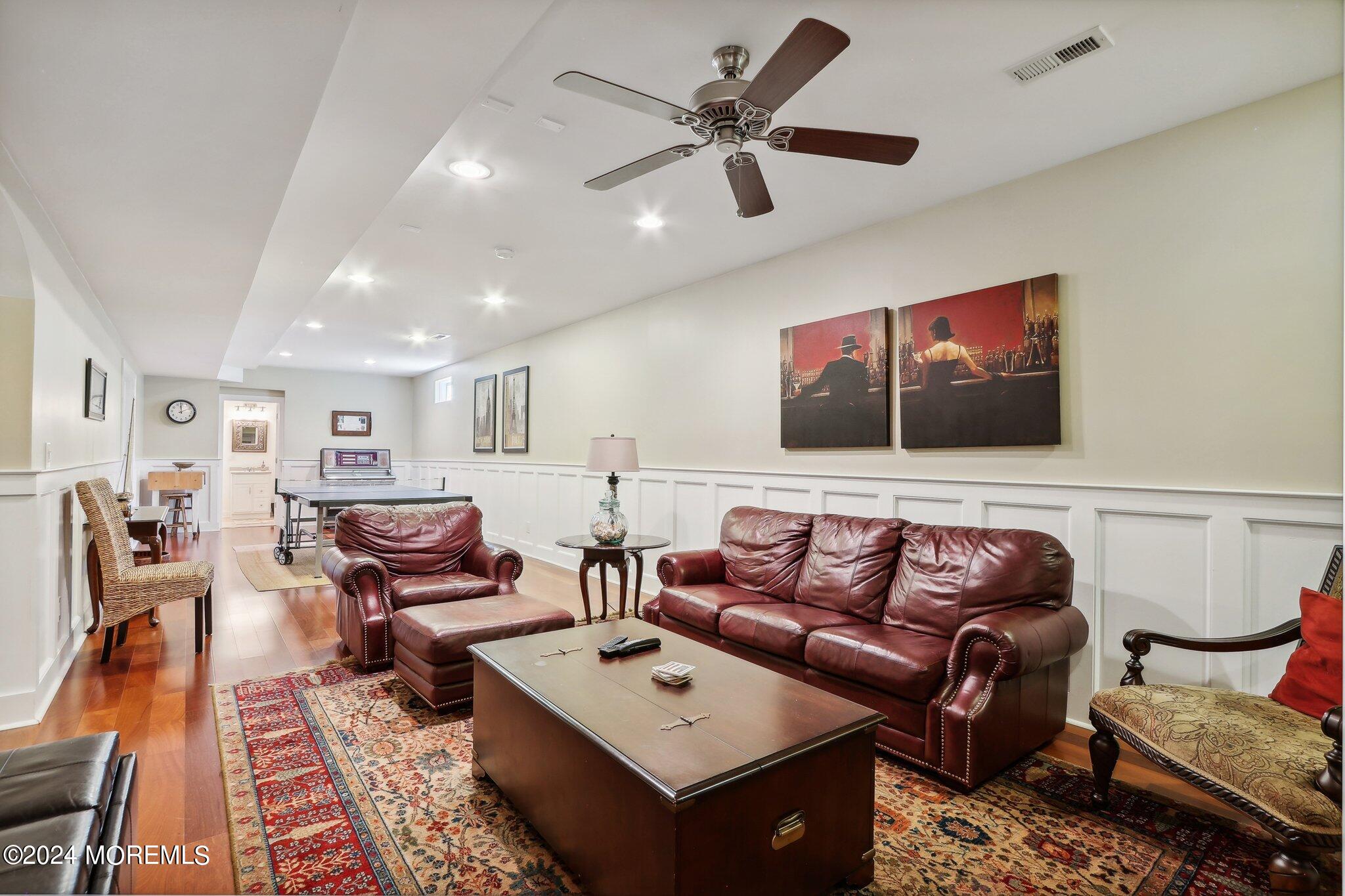 317 Worthington Avenue Spring Lake, NJ 07762 - Photo 64 of 85 a living room with furniture ceiling fan and a rug