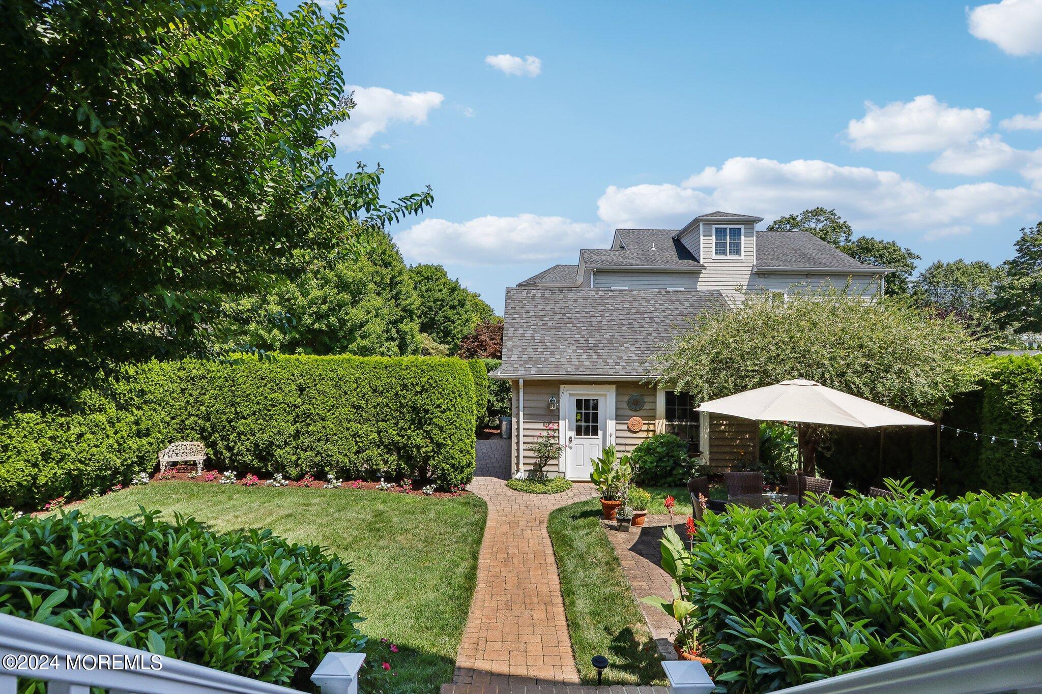 317 Worthington Avenue Spring Lake, NJ 07762 - Photo 71 of 85 a front view of a house with a yard and fountain