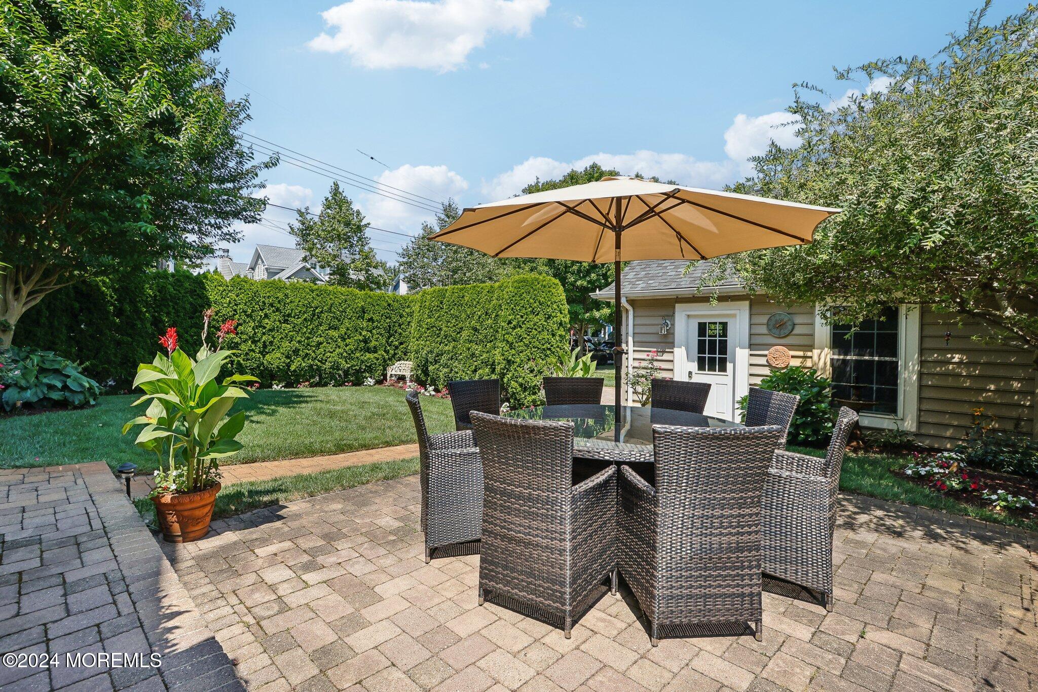 317 Worthington Avenue Spring Lake, NJ 07762 - Photo 72 of 85 a view of backyard with seating space and trees